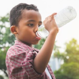 Kid drinking water from a bottle