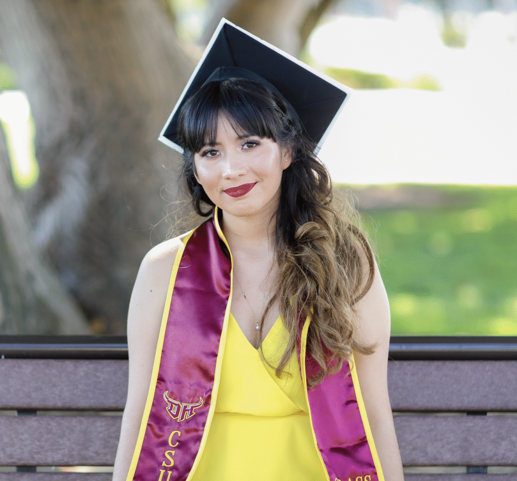 Foster Love Family Fellowship scholar posing in cap and sash