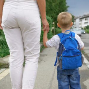 emergency foster mom and son walking away from camera