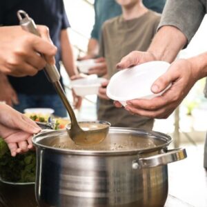 handing out food at a shelter