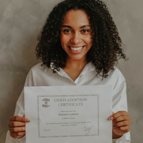 woman holding adoption certificate