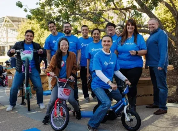 Gallery_1 Experian volunteers posing with bikes they built