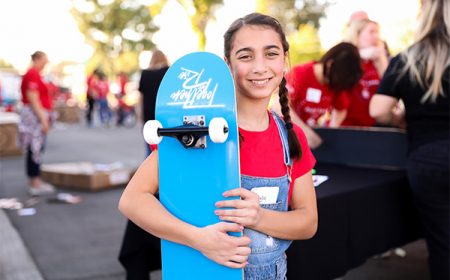 girl holding skateboard